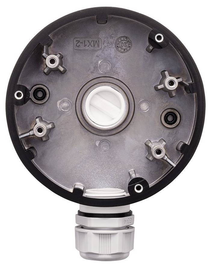Un composant technique circulaire à surface métallique avec plusieurs connexions à vis. Un connecteur de câble blanc est visible en bas.
