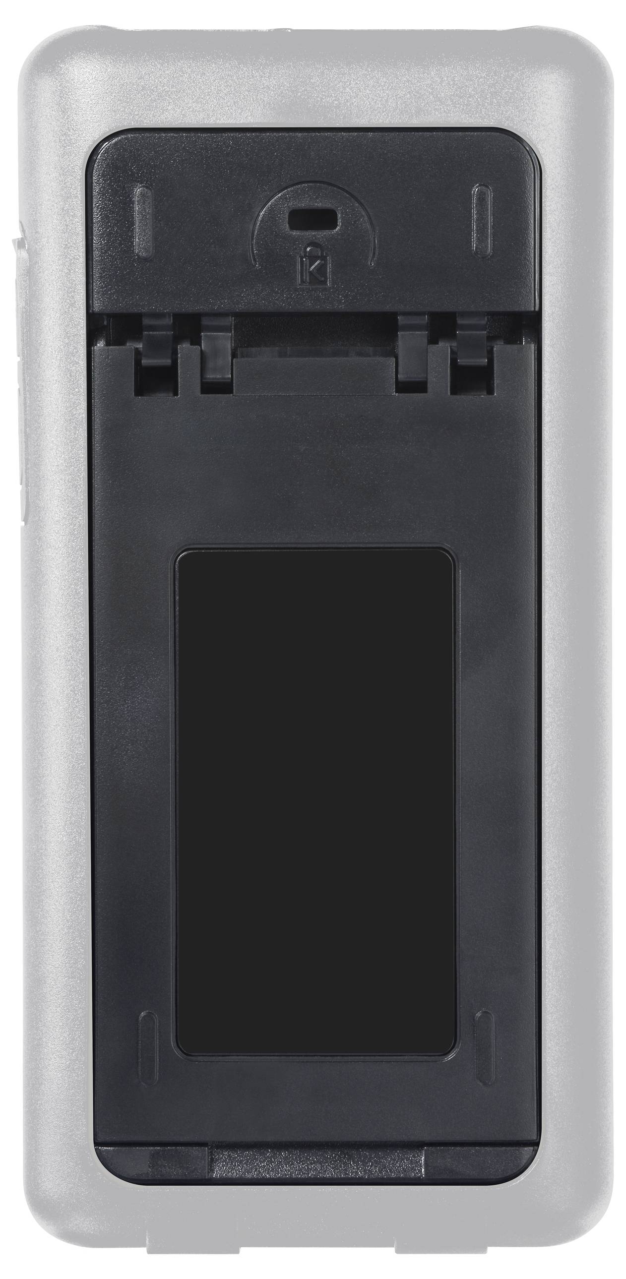 Le dos d'un appareil électronique, vraisemblablement une télécommande, avec un compartiment à piles ouvert.