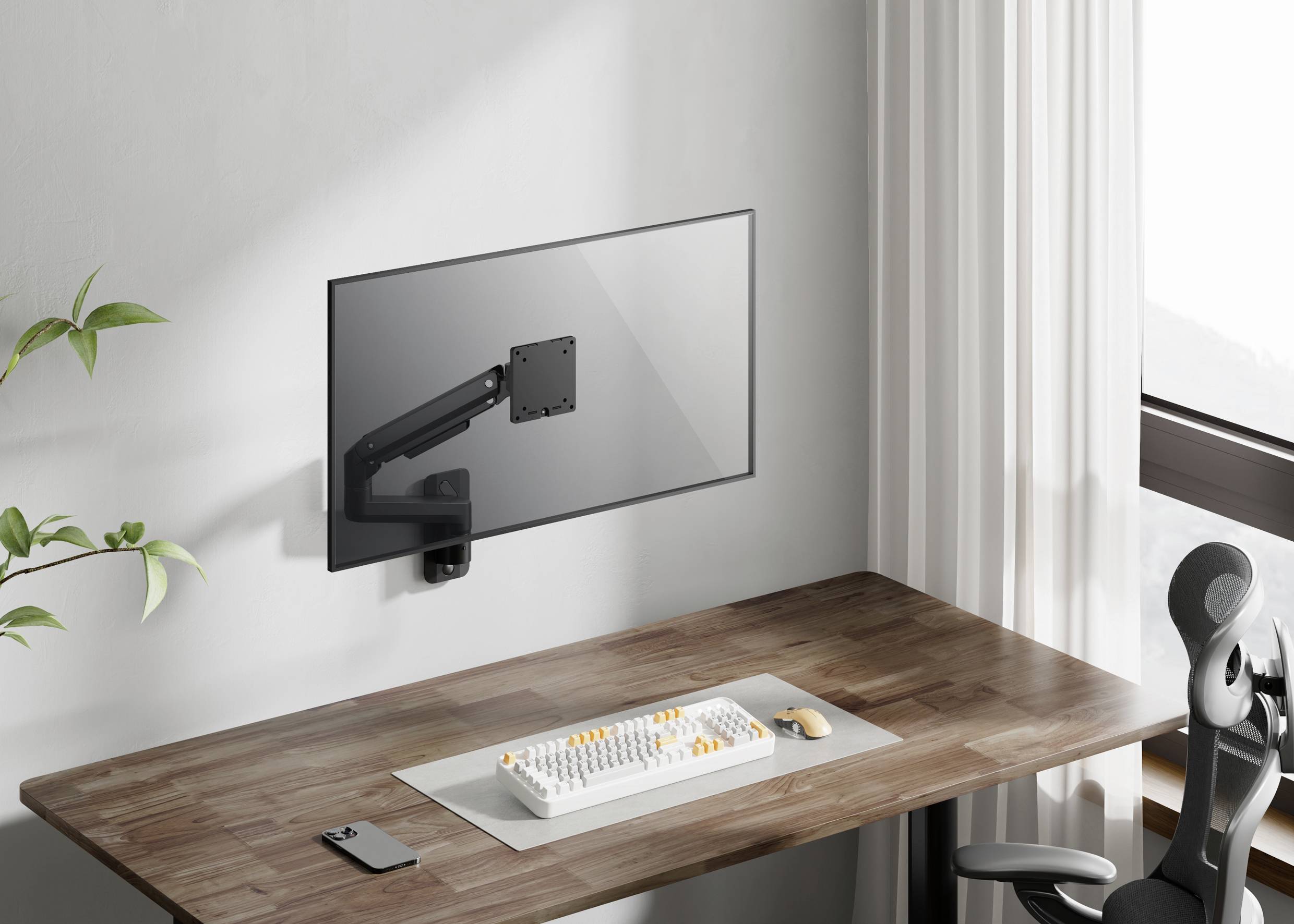 Un bureau moderne avec une surface en bois, sur lequel se trouvent un clavier et un smartphone. Un support d'écran réglable est fixé au mur.