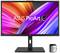 Un moniteur ASUS ProArt OLED avec des couleurs vives à l'écran, avec un appareil de calibrage placé devant le moniteur.