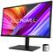 Un moniteur informatique avec l'inscription 'ASUS ProArt OLED' affiche des lignes ondulantes colorées. Un petit appareil est posé à côté.