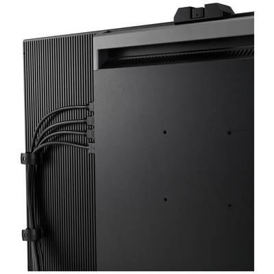 Grand appareil électronique noir en gros plan. Câbles visibles sur le côté. Accent mis sur la structure de lignes verticales et les connexions.