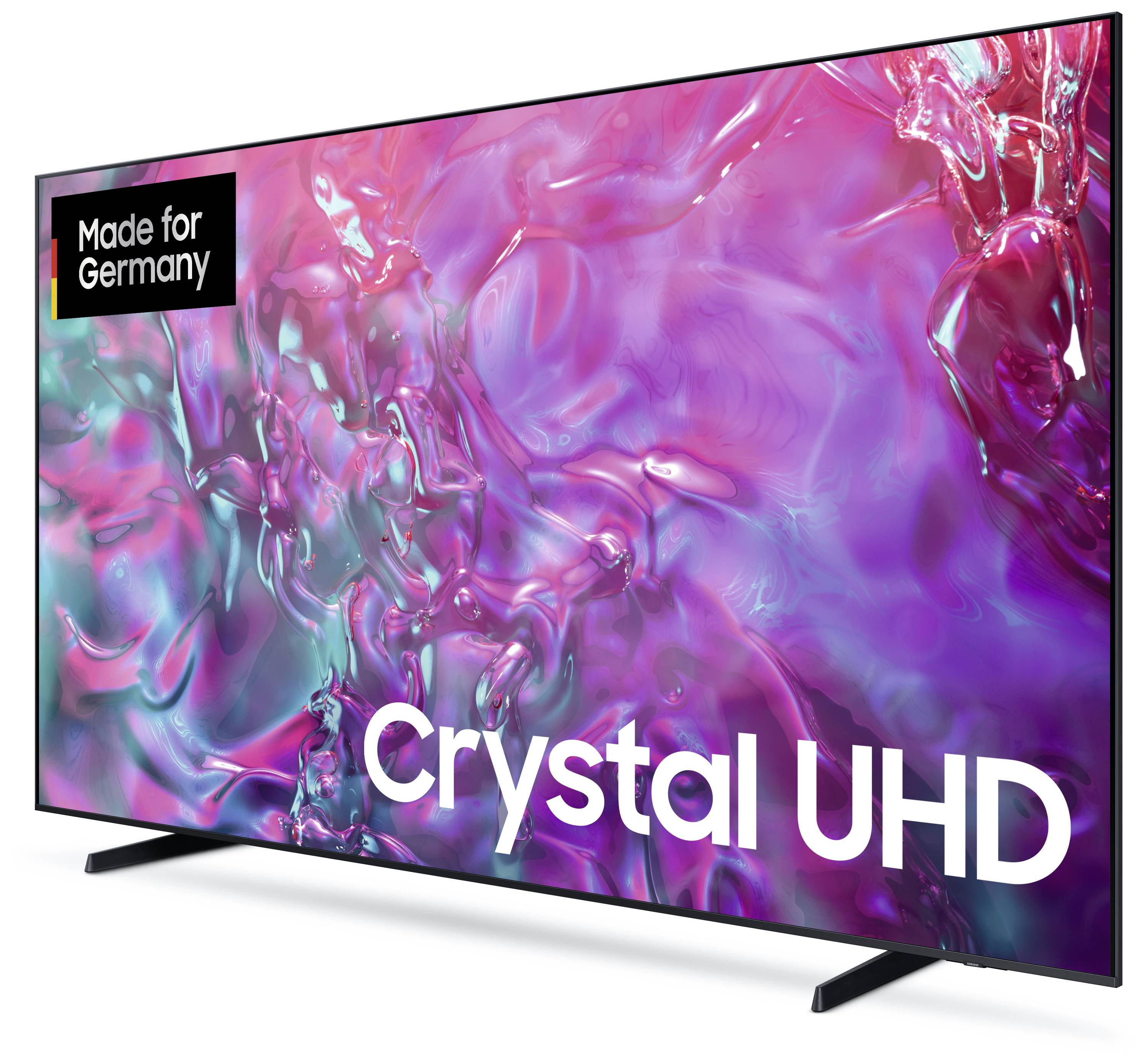 Un téléviseur avec un arrière-plan coloré et abstrait chatoyant. Texte à l'écran : « Made for Germany Crystal UHD ».