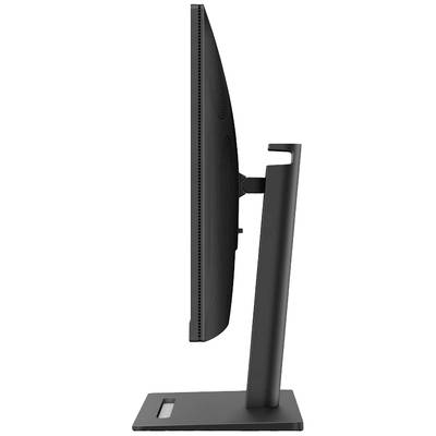 Vue unilatérale d'un moniteur d'ordinateur noir et élancé avec un cadre minimal, reposant sur un socle stable.