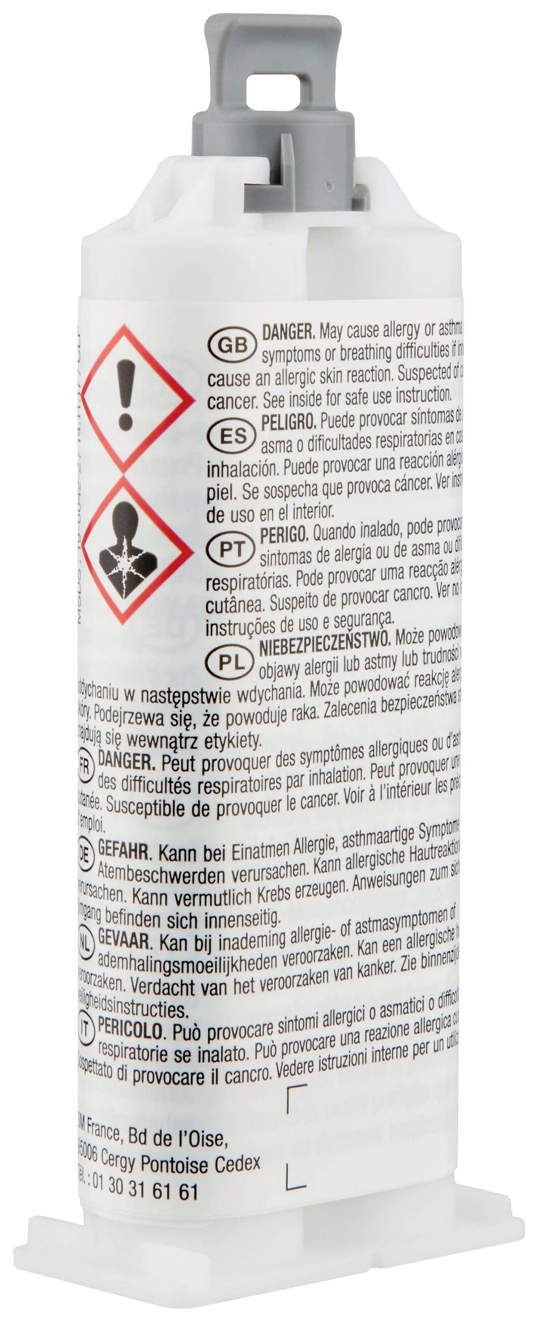 Un tube avec des avertissements dans différentes langues. En haut, des symboles de danger avec un point d'exclamation et une éprouvette.
