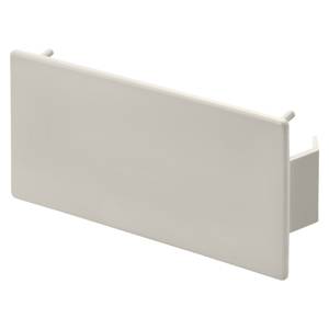 Couvercle rectangulaire beige aux bords lisses. Adapté pour habiller les prises électriques ou les éléments de commutation.