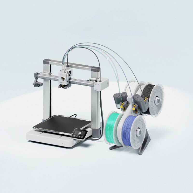 Imprimante 3D avec des bobines de filament doubles en bleu et gris. L'appareil présente une structure moderne et compacte adaptée à une impression précise.