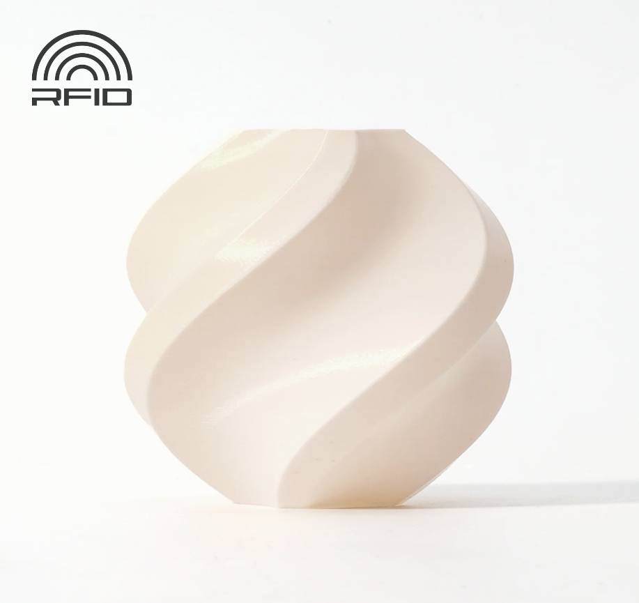 Un objet beige, de forme spiralée, sur un fond blanc avec un petit logo 'RFID' en haut à gauche.