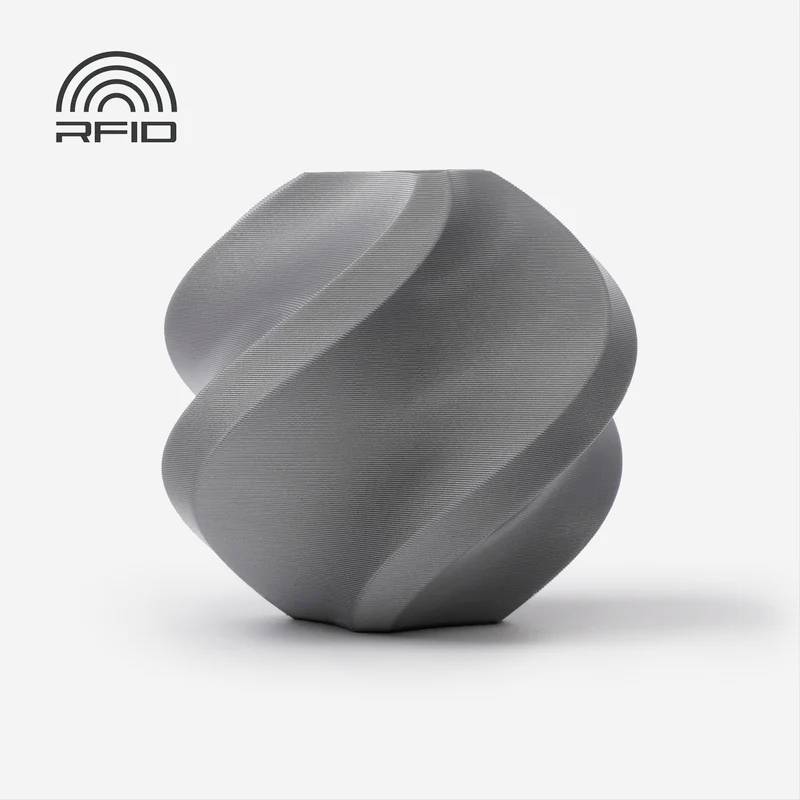 Cube gris, spiral et abstrait sur fond blanc, logo 'RFID' en haut à gauche.
