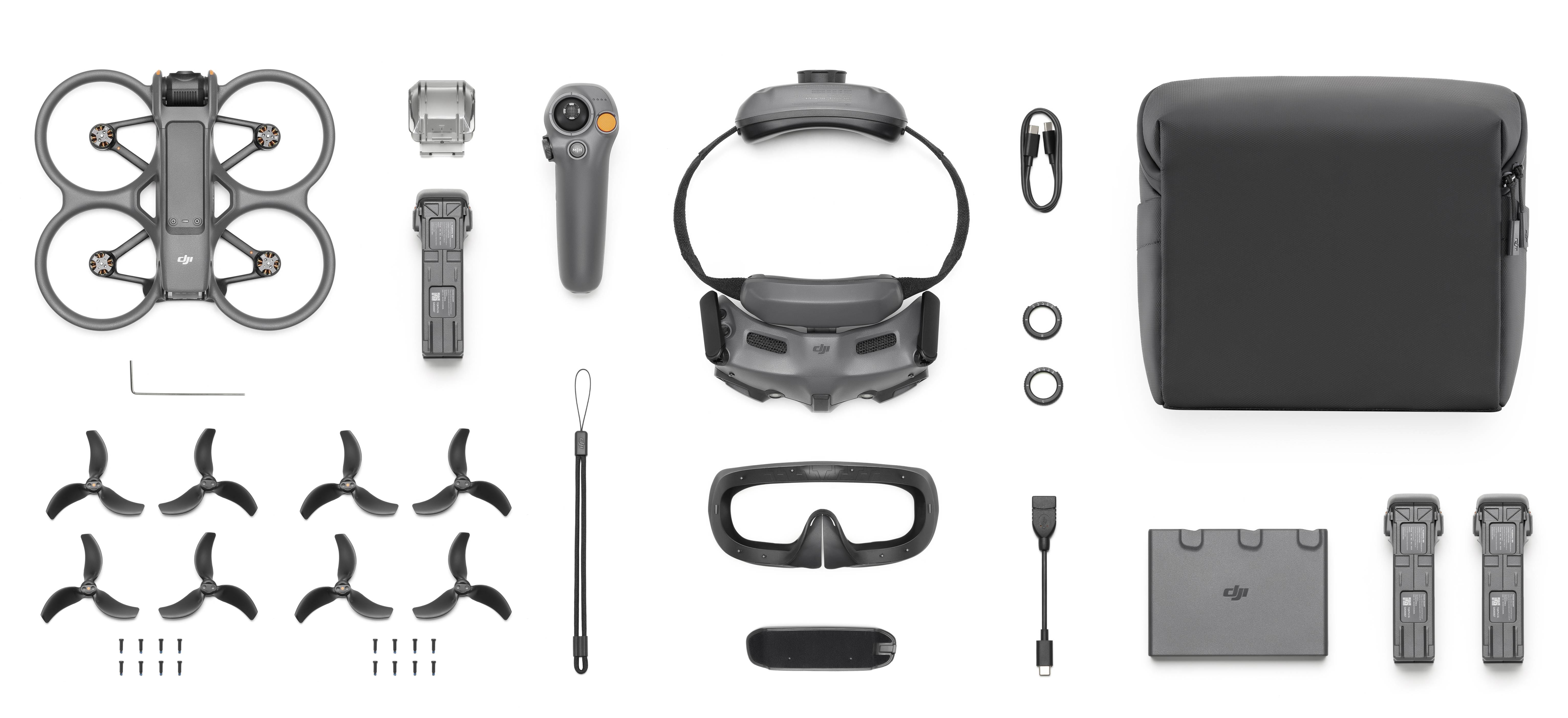 'Kit d'accessoires de drone comprenant un châssis de drone, une télécommande, des lunettes, des hélices, un tournevis et un sac. Essentiel pour le vol de drone.'