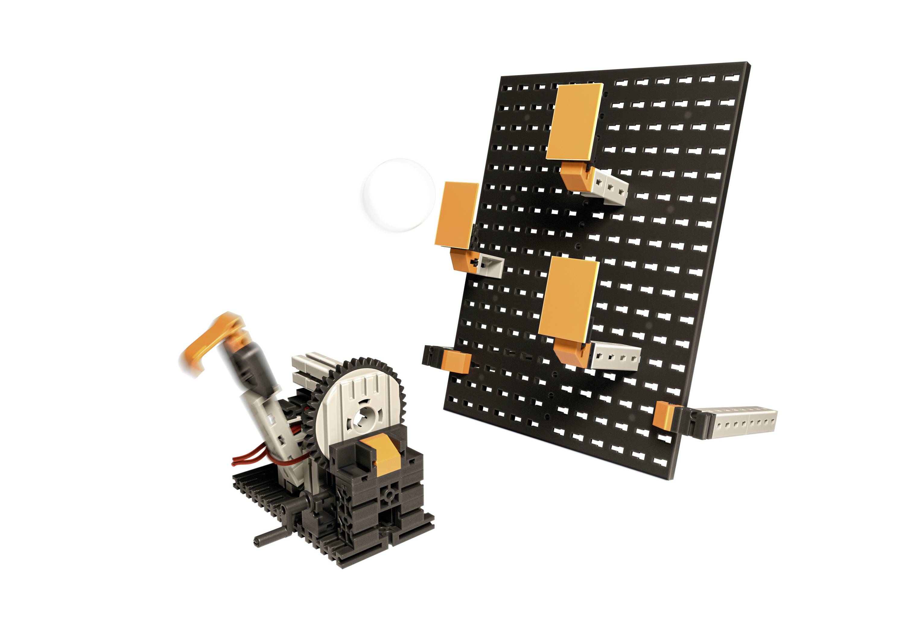 'Kit de composants techniques pour expériences avec moteur et pièces à assembler sur un tableau noir, adapté à la formation technique.'