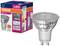Ampoule LED Osram, 575 lumens, 6,9W, Lumière du jour 6500K. Classe énergétique F, culot GU10, présentée à côté de son emballage.