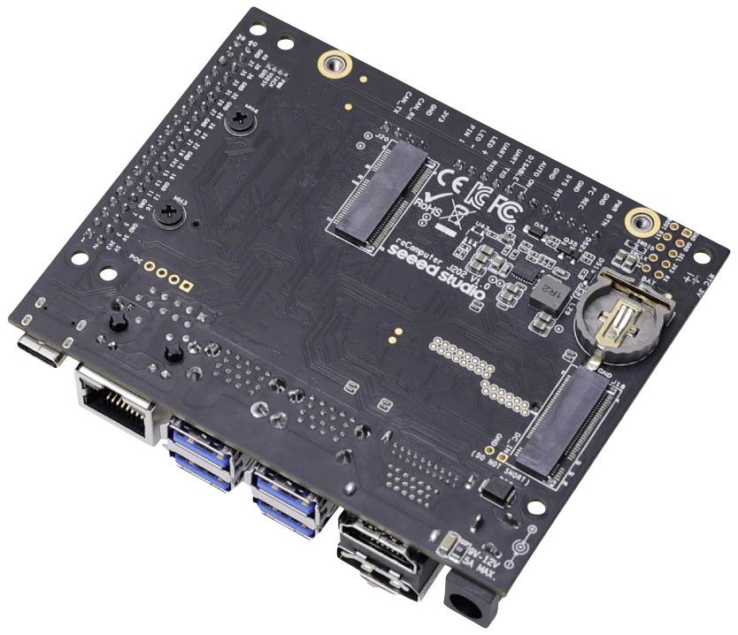 Carte mère d'ordinateur avec plusieurs ports USB, connexions Ethernet et un support de batterie.