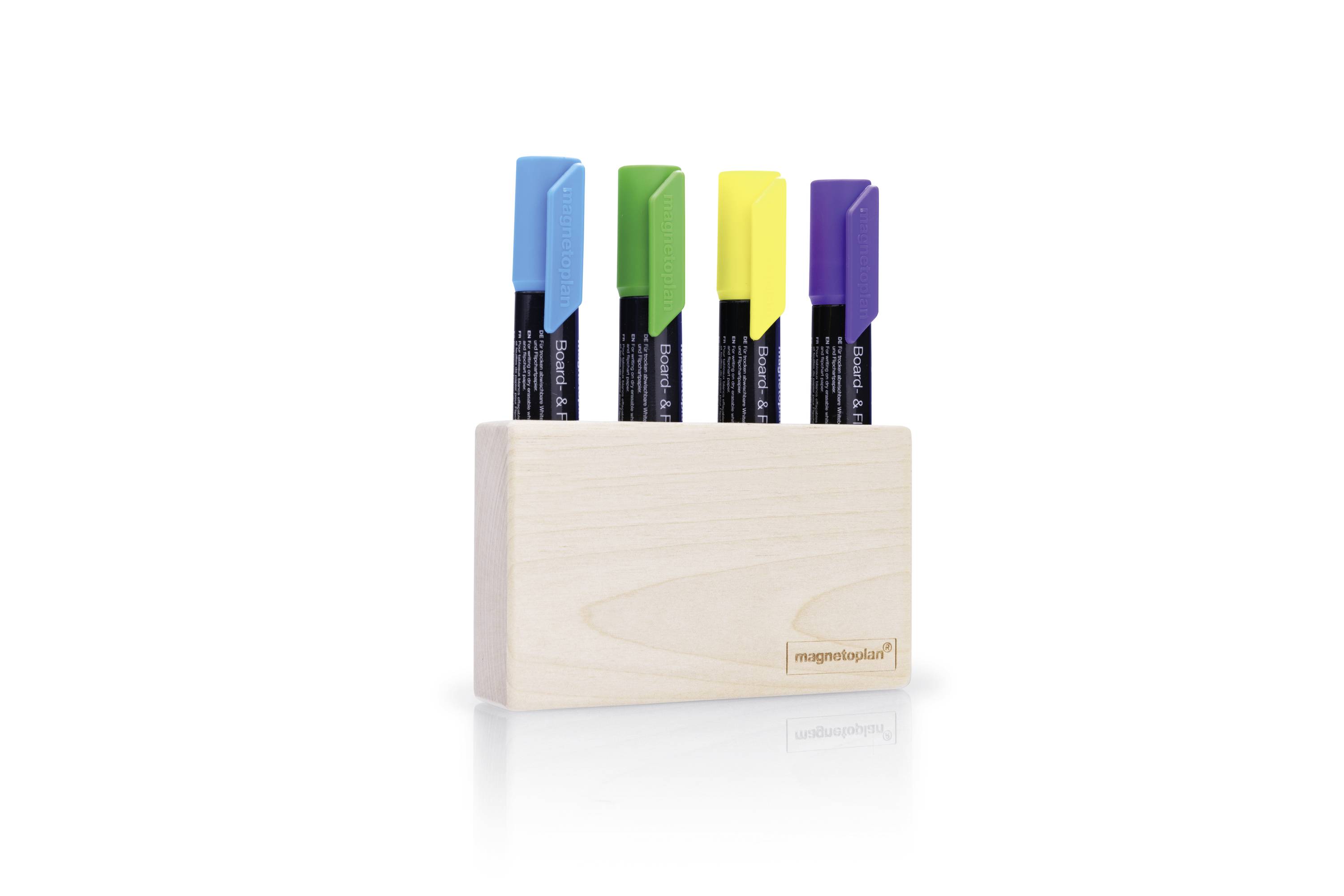 Quatre aimants de couleurs différentes - bleu, vert, jaune et violet - sont placés dans un support en bois clair. Le logo 'magnetoplan' est visible sur le support.