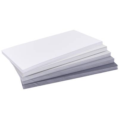 Une pile de feuilles de papier blanches et grises est posée les unes sur les autres.