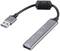 Un adaptateur USB gris avec trois ports USB 3.0 et un connecteur pour ordinateur.
