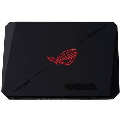 Un boîtier d'ordinateur portable noir avec un logo rouge lumineux au centre, donnant une impression futuriste.