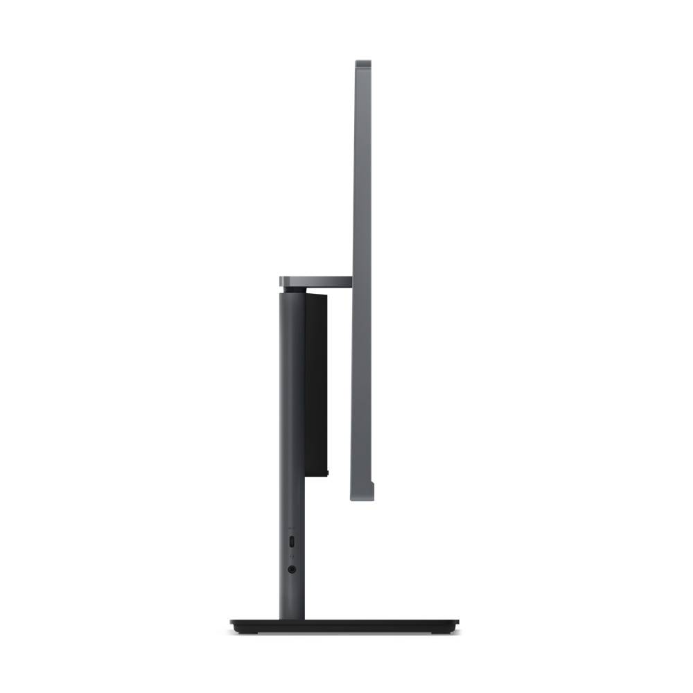 Vue latérale d'un écran d'ordinateur noir sur socle, montrant son design élégant et sa faible profondeur.