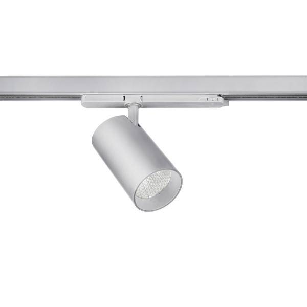 Un projecteur LED cylindrique orientable en argent, monté sur un rail. Adapté pour un éclairage directionnel.