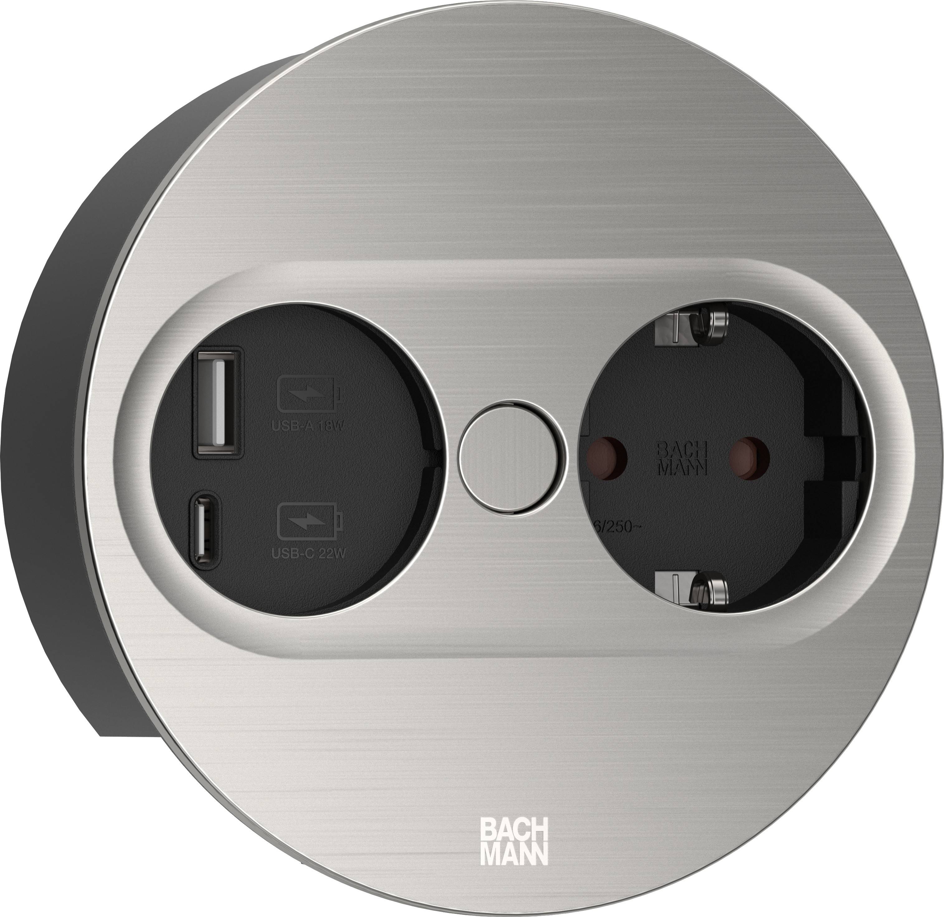 Prise ronde en métal avec une connexion Schuko et deux ports USB. Nom de marque 'BACHMANN' imprimé en bas.
