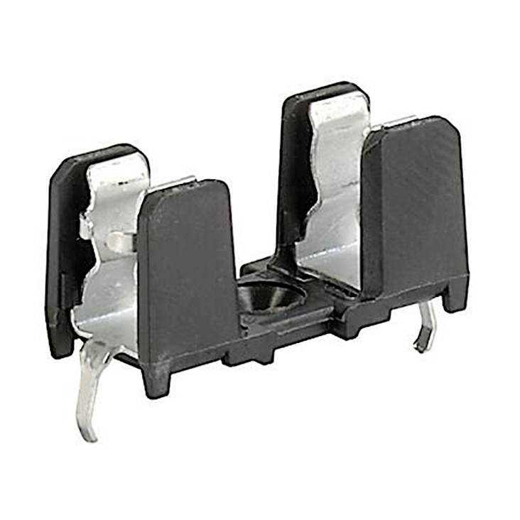 Un support de fusible noir en plastique avec des bornes métalliques, adapté pour le montage sur un circuit imprimé dans des appareils électroniques.