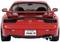 Une voiture rouge avec un aileron arrière, modèle 'RX-7' et logo 'Mazda', montrant une plaque d'immatriculation avec des caractères japonais.
