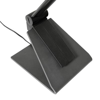 Un interrupteur au pied noir avec une surface inclinée et texturée, et un câble connecté. Utilisé pour le contrôle des appareils.