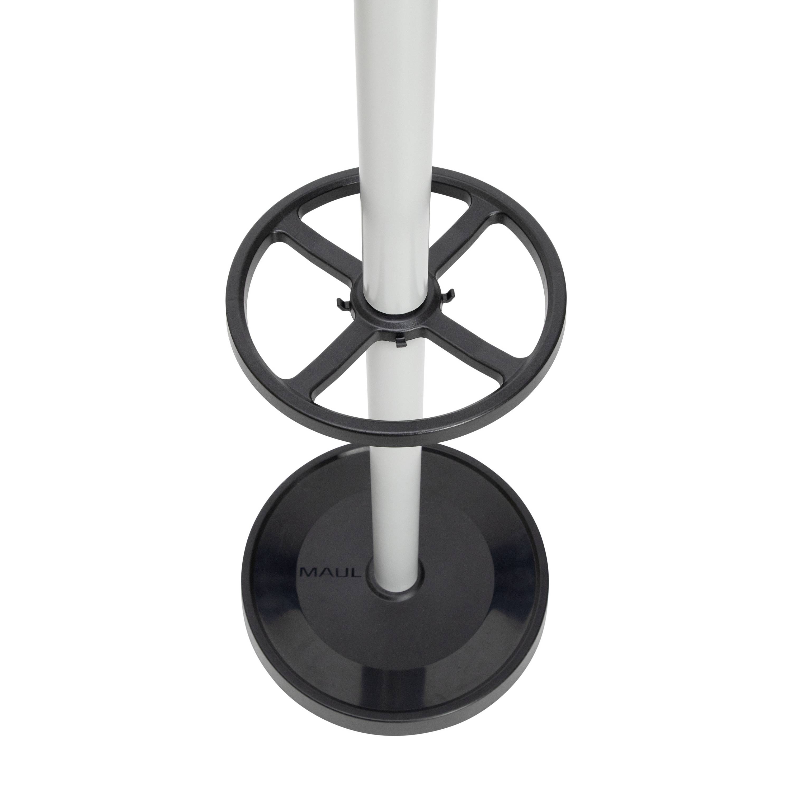 Un support vertical en métal blanc comme du papier, avec un anneau noir et une base ronde. Le nom de marque 'MAUL' est visible en bas.