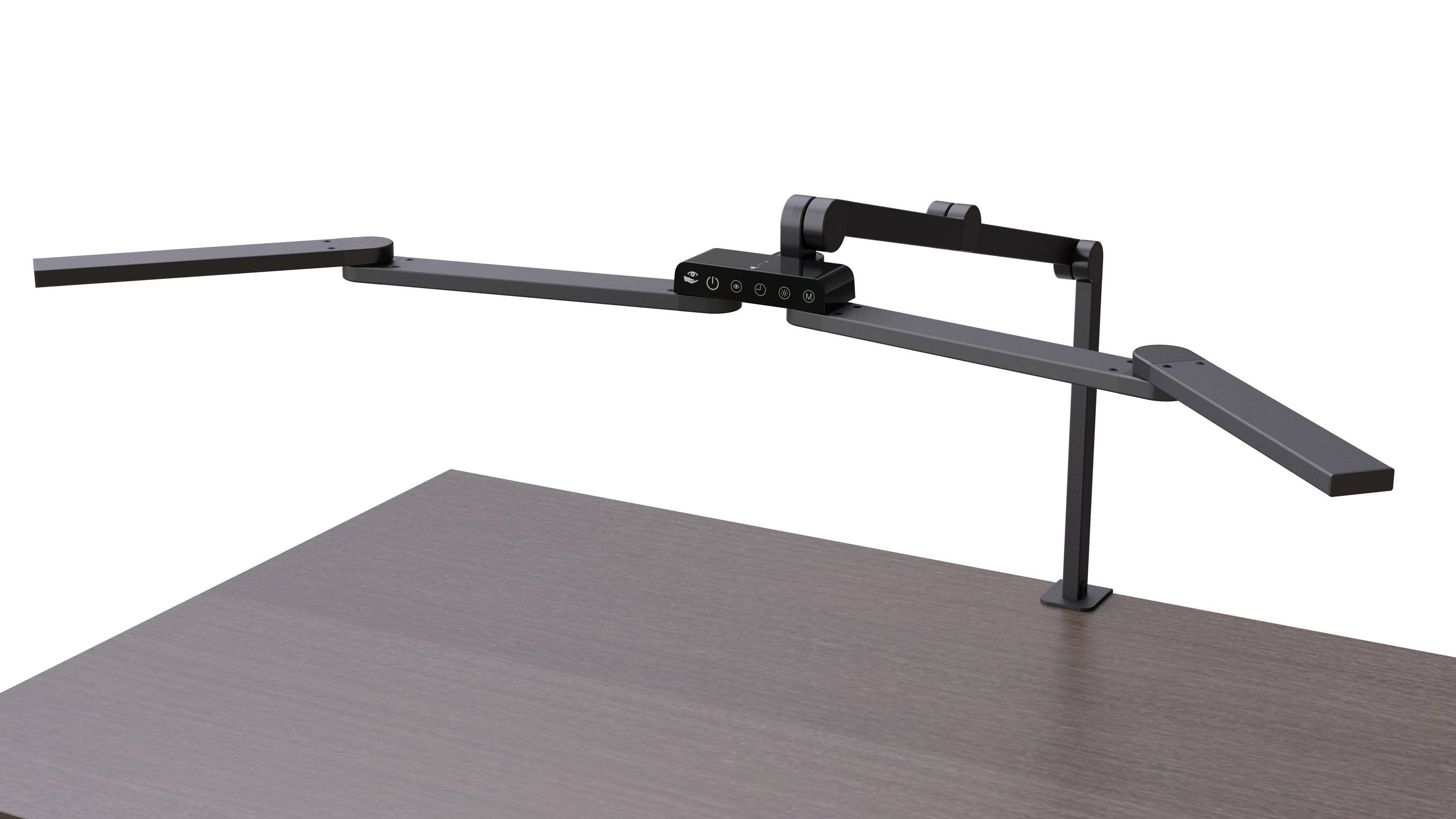 Une lampe de bureau LED noire flexible avec des bras ajustables, montée sur un plateau en bois sombre.