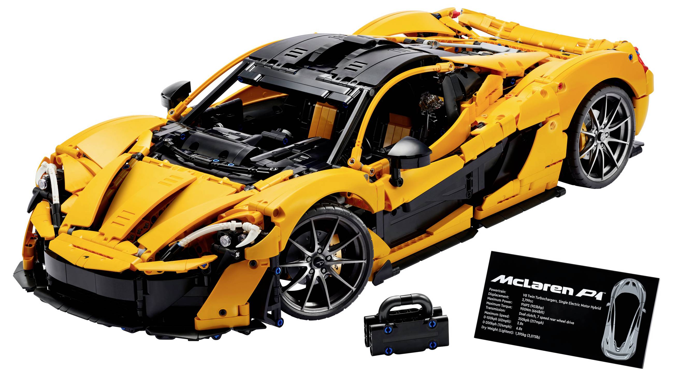 Modèle LEGO d'une McLaren P1 orange avec un toit noir, présenté sur une surface blanche à côté d'un tableau avec des détails.