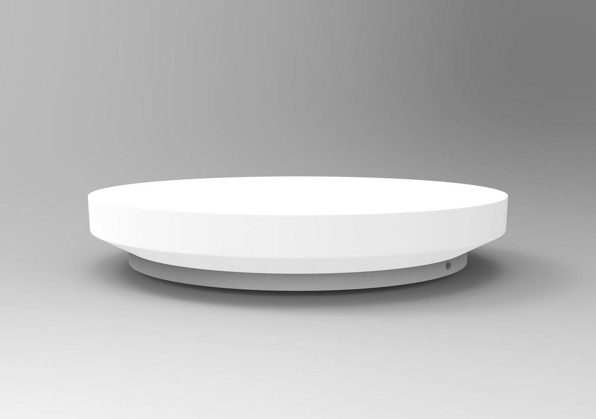 Une plateforme blanche simple et ronde devant un fond gris.