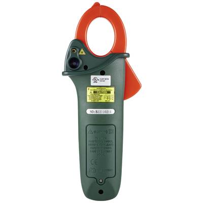 Un appareil de mesure électrique vert avec une pince orange et un avertissement jaune. Il mesure la tension électrique et fonctionne sur batterie.