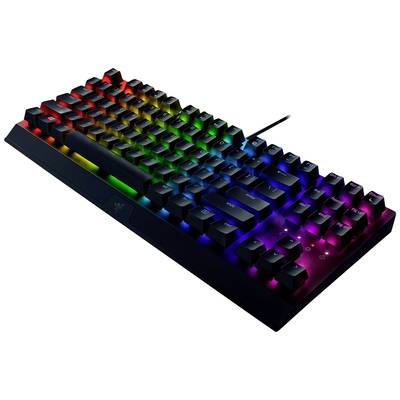 Clavier mécanique avec éclairage LED arc-en-ciel, montrant le câble connecté et une vue diagonale des touches.