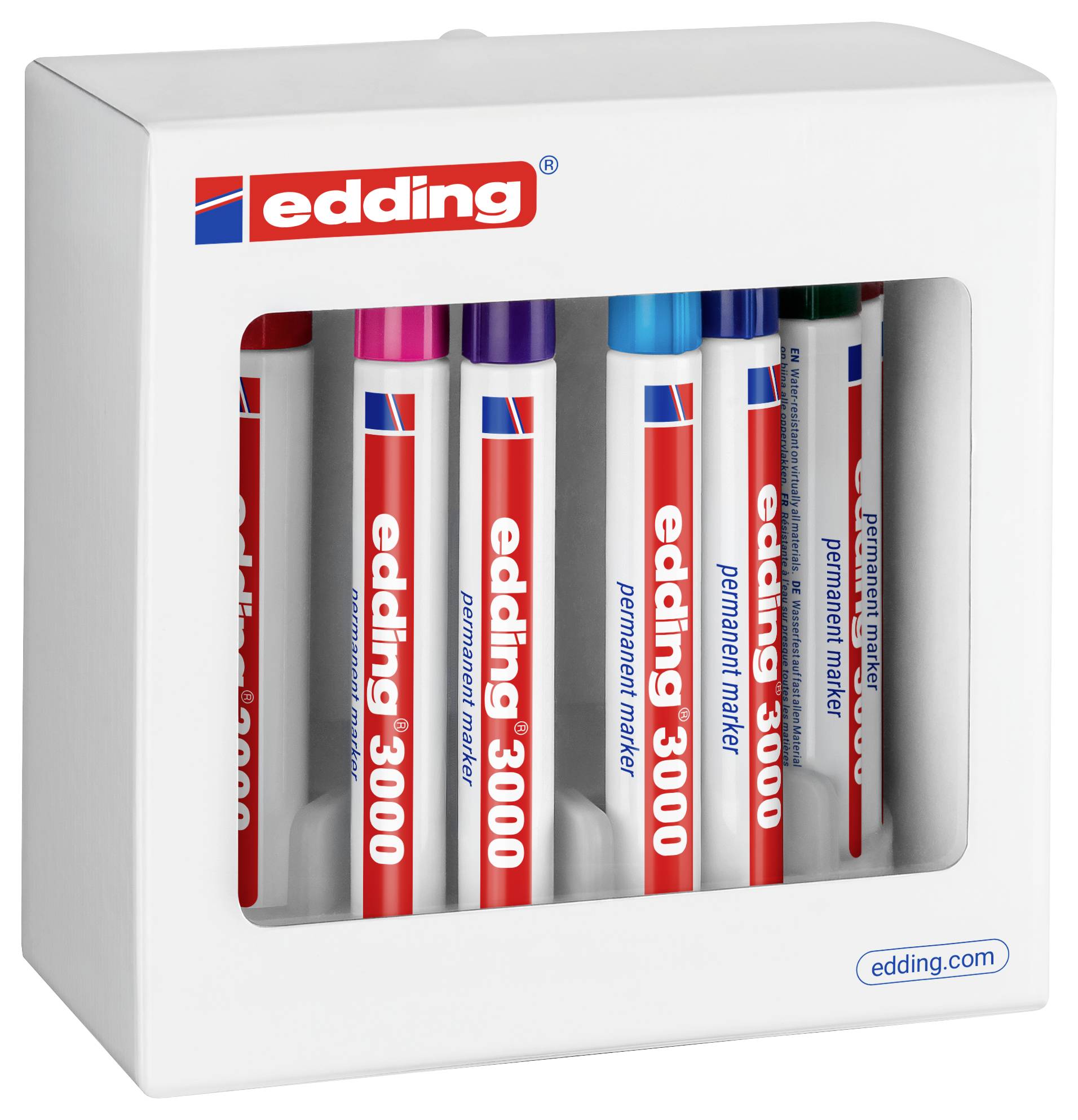Boîte d'ensemble de marqueurs permanents Edding blancs avec six marqueurs visibles à travers une fenêtre frontale, étiquetée « edding 3000 » et « edding 3300 ».