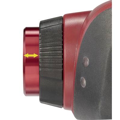 Gros plan d'une pièce mécanique rouge avec un marquage en double flèche jaune indiquant une direction de réglage.