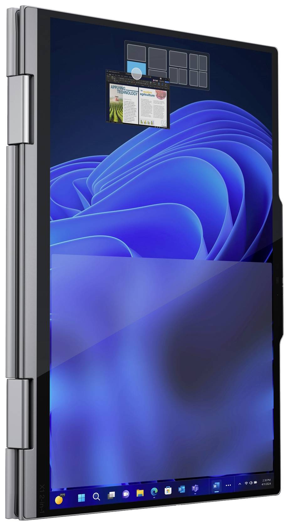 Un ordinateur portable en position verticale en mode tablette affiche un design d'écran bleu avec une fenêtre ouverte en haut. Des applications sont visibles dans la barre des tâches.