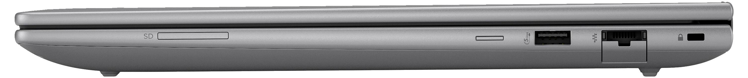Un ordinateur portable gris, fermé, vu de profil, doté de plusieurs ports et d'une ouverture pour lecteur de disque.
