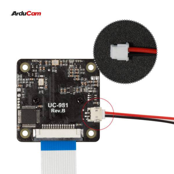 Une carte ArduCam portant la référence 'UC-981 Rev.B', combinée avec un connecteur blanc mis en évidence et des câbles rouges/noirs.
