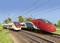Deux trains à grande vitesse circulent en parallèle sur des voies ferrées. L'un est rouge et vert, l'autre blanc et rouge. Des lignes électriques sont visibles.