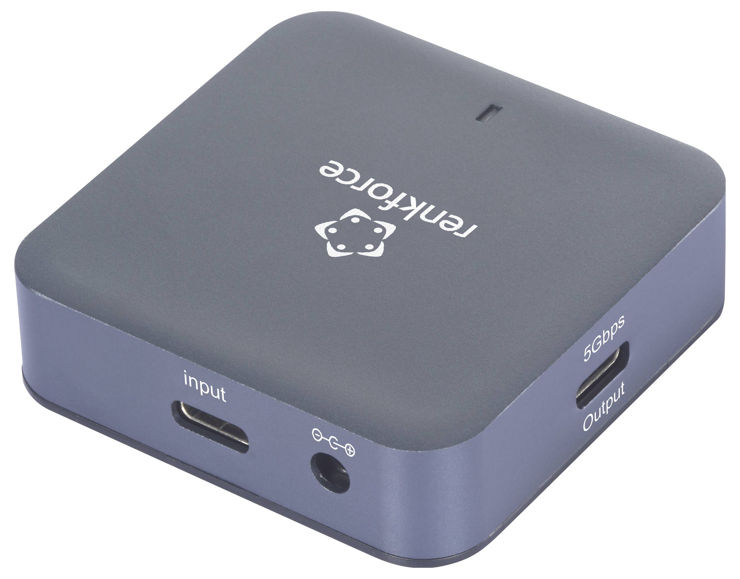 Un adaptateur noir portant les inscriptions 'input' et 'output' sur sa face avant, probablement destiné à des fins de transmission.