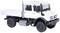Une miniature blanche d'un camion au design robuste, avec des roues noires, photographiée de profil.
