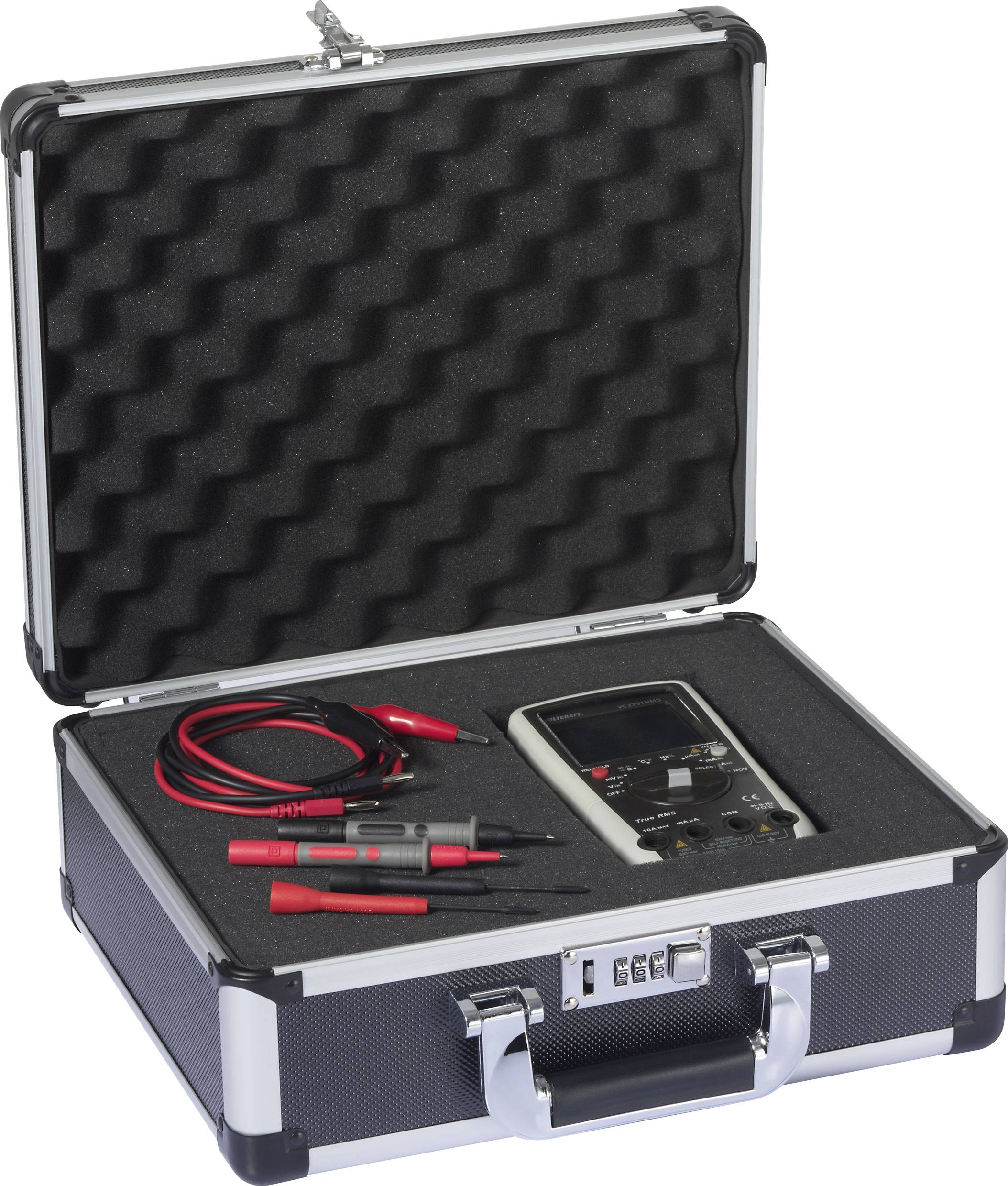 Une valise ouverte présente un multimètre avec des câbles dans un calage en mousse, prêt pour le transport ou l'utilisation.