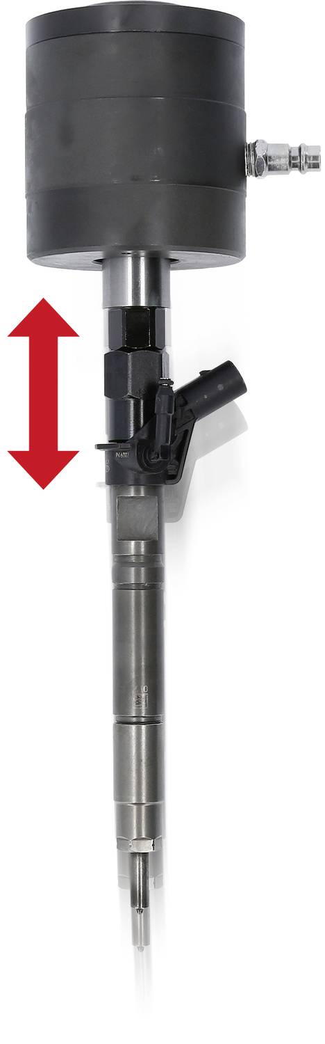 Un dispositif cylindrique argenté avec une tête noire et une flèche rouge pointant vers le haut. Il semble s'agir d'un instrument technique.