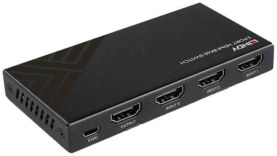 Un commutateur HDMI noir avec trois entrées et une sortie. Sur le côté se trouve un connecteur pour l'alimentation électrique 5V DC.