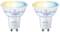 Deux ampoules LED WiZ Whites avec culot GU10. Elles s'illuminent en bleu et jaune en haut. Adaptées pour un éclairage intelligent.