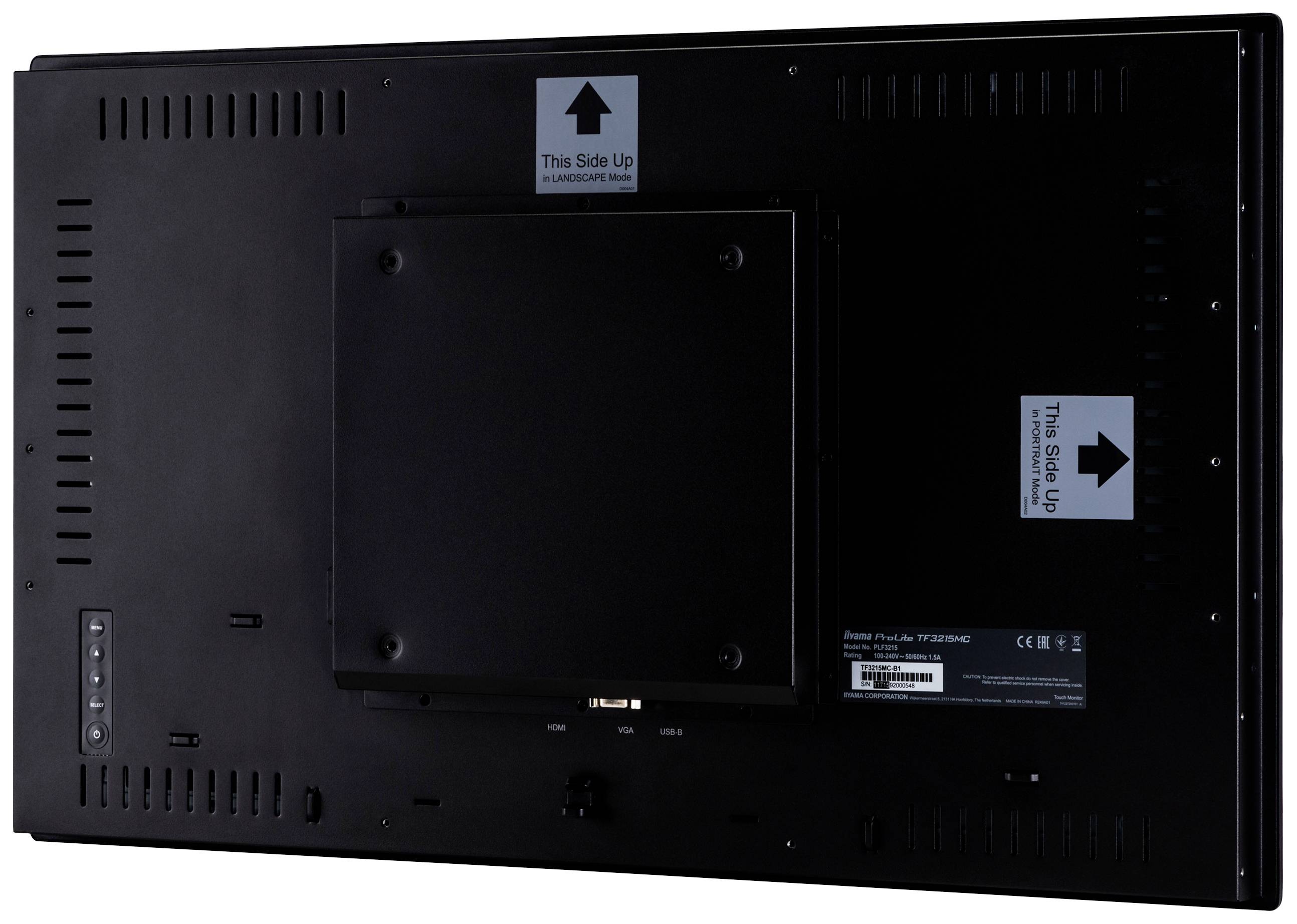 Vue arrière d'un grand écran noir avec une plaque de montage et des autocollants indiquant l'orientation correcte.