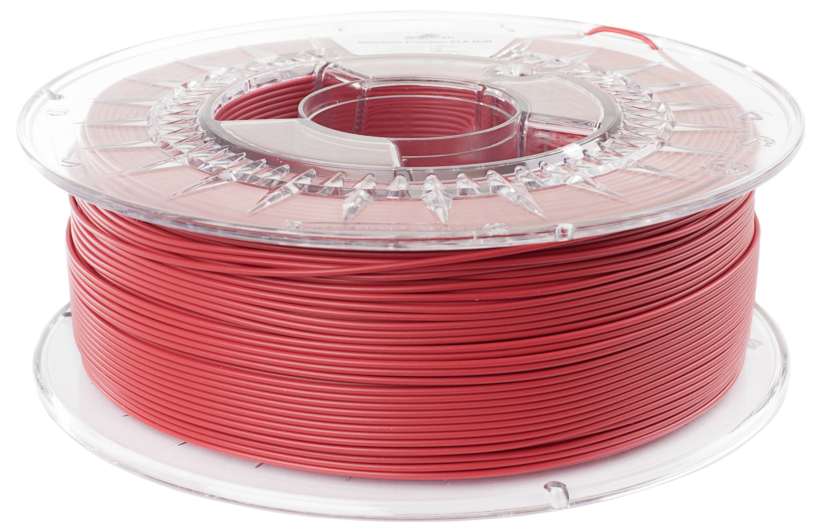 Une bobine de filament de plastique rouge pour imprimante 3D.
