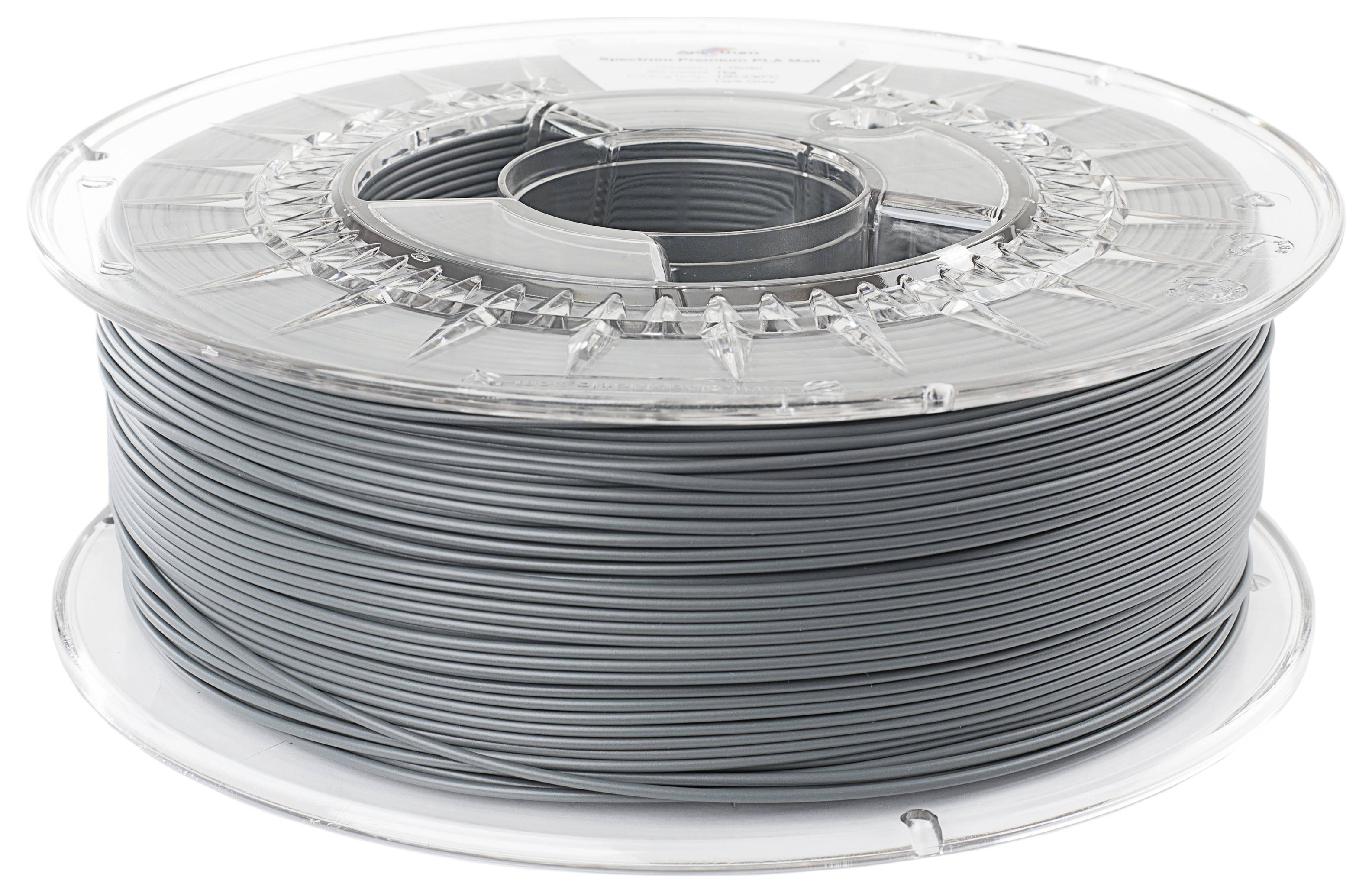 Bobine de filament gris en plastique pour impression 3D, enroulée sur un support en plastique transparent.