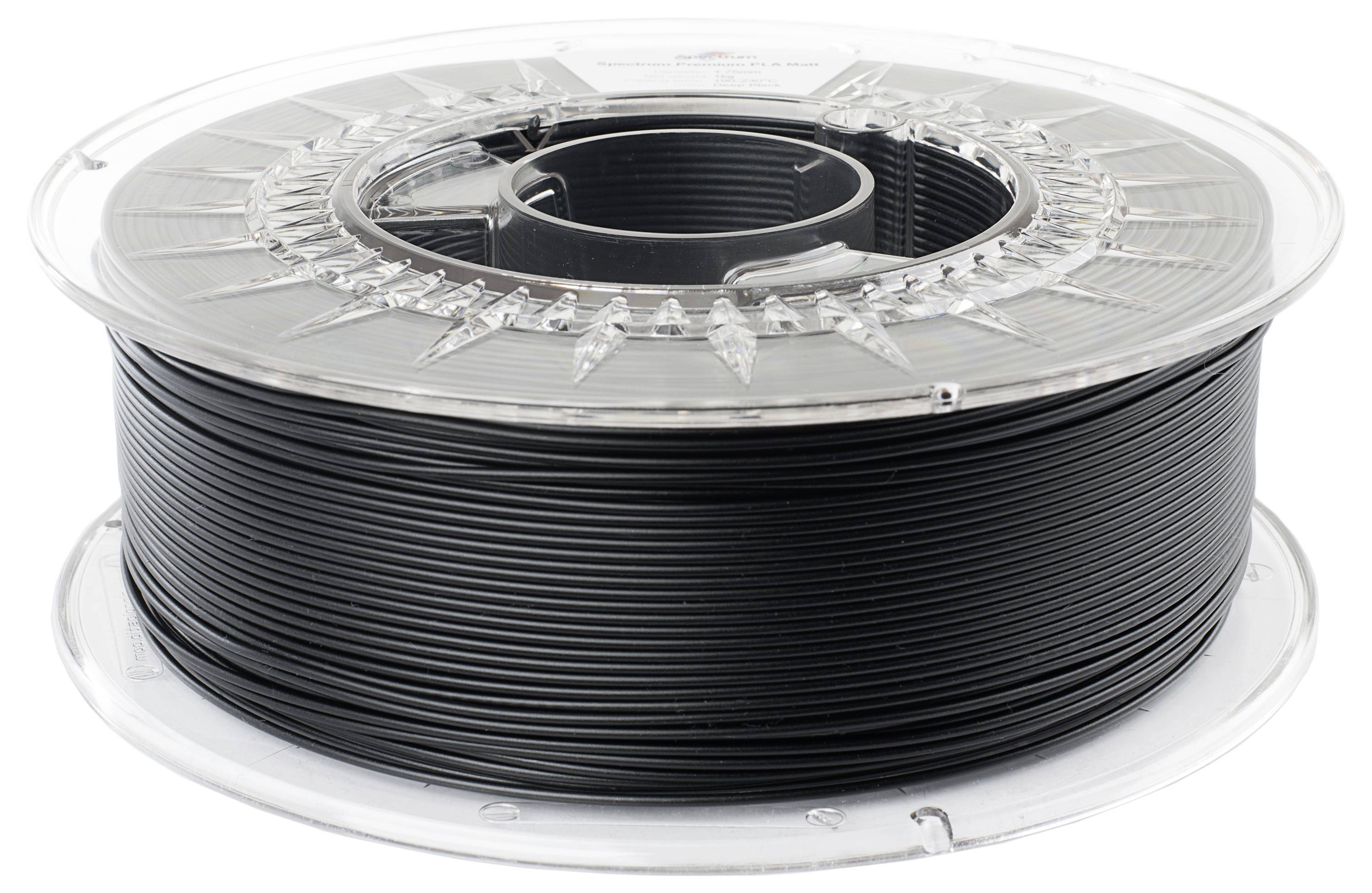 Une bobine de filament noir pour imprimante 3D.