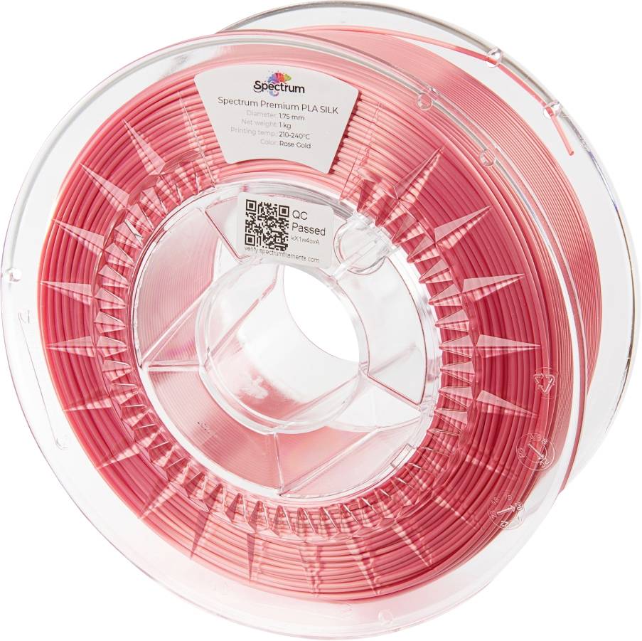 Un rouleau de filament PLA-Silk couleur or rose pour imprimante 3D. L'étiquette indique la marque, le matériau et un code QR.
